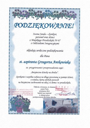 Na zdjęciu widać podziękowania od dyrekcji Miejskiego Przedszkola numer 67 w Katowicach. Na dyplomie widać pieczątki dyrekcji i przedszkola oraz malunki