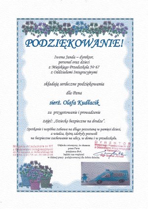 Na zdjęciu widać podziękowania od dyrekcji Miejskiego Przedszkola numer 67 w Katowicach. Na dyplomie widać pieczątki dyrekcji i przedszkola oraz malunki