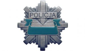 zdjęcie kolorowe policyjna odznaka