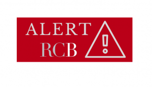 zdjęcie kolorowe: na czerwonym tle biały napis o treści ALERT RCB
