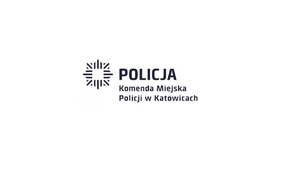 zdjęcie kolorowe: na białym tle niebieski napis o treści Komenda  Miejska Policji w Katowicach