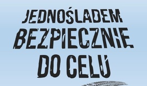 zdjęcie kolorowe: na błękitnym tle czarny napis o treści: jednośladem bezpiecznie do celu