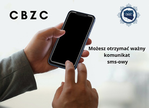 zdjęcie kolorowe: przedstawiające dłoń trzymającą telefon komórkowy z informacją o możliwości otrzymania ważnego komunikatu sms