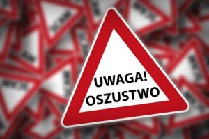 zdjęcie kolorowe: znak ostrzegający i napis o treści uwaga oszustwo