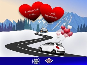 zdjęcie kolorowe: plakat przedstawiający samochód jadący droga do domu. Nad samochodem umieszczono dwa czerwone serca