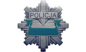 zdjęcie kolorowe: odznaka policyjna
